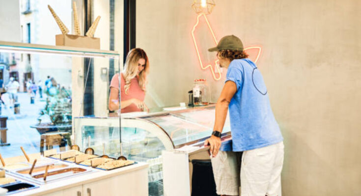 a man asking for an ice cream to a woman
