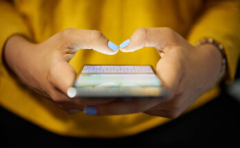 woman-typing-phone-message-on-social-network-at-night