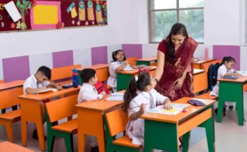 a teacher is teaching in the class