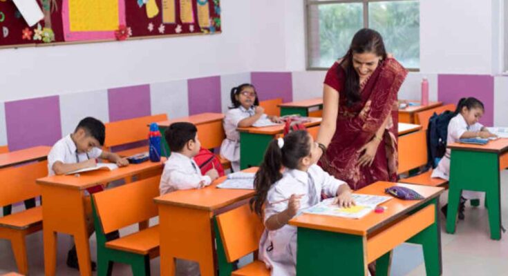 a teacher is teaching in the class