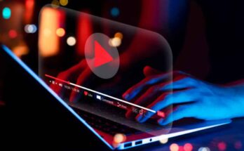 online-movie-streaming-with-laptop-computer-young-man-watching-a-movie-on-a-mobile-phone-with