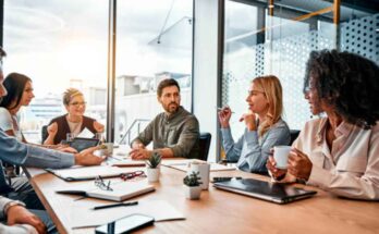 business-concept-multinational-professionals-business-people-discussing-daily-topics-by-table