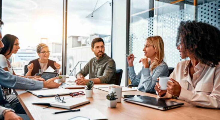 business-concept-multinational-professionals-business-people-discussing-daily-topics-by-table