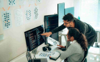 hispanic-programmers-collaborating-on-software-development-in-a-modern-office-setting