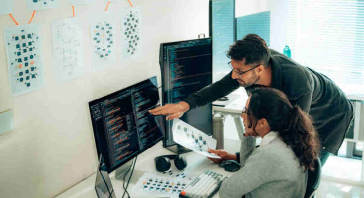 hispanic-programmers-collaborating-on-software-development-in-a-modern-office-setting